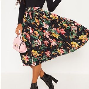 Black floral printed pleated midi skirt